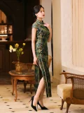 Front-side view of a woman in a form-fitting shanghai style qipao dress, retro republican era cheongsam in green and gold mulberry silk with high slit, styled with classic red earrings.