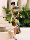 Model lifting her leg to show the high slit design of a women high end yellow mulberry silk cheongsam dress, holding a hand fan for a graceful vintage pose.