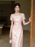 Indoor shot of women's summer modified cheongsam, elegant new Chinese waist cinched pleated dress in light pink with unique textured fabric, square neck puff short sleeve for formal summer events