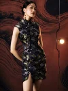 Close-up shot of ink black silk mini cheongsam dress, focusing on the traditional frog buttons, pearl fasteners, and intricate koi fish brocade pattern woven into the premium satin fabric.