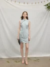 Full front view of a model in a light blue modern Chinese sleeveless short cheongsam dress, standing to highlight the elegant fit and fabric sheen.