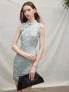 Model posing with a black clutch, wearing a light blue modern Chinese sleeveless short cheongsam dress that blends traditional jacquard with contemporary tailoring.