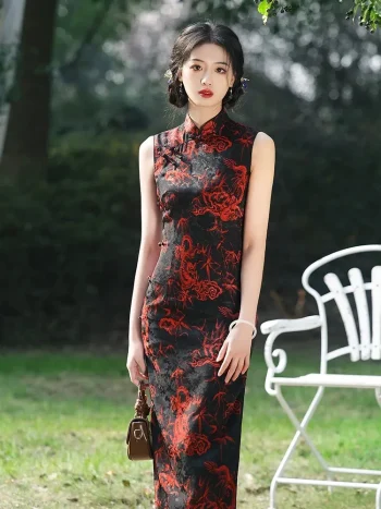 Front view of women's long vintage floral sleeveless high cut qipao (cheongsam) with bold red dragon print on black fabric, model standing outdoors holding a small brown handbag.
