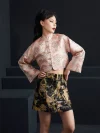 Front view shot of the misty pink modern jacquard short qipao top, highlighting the structured mandarin collar, wide flared sleeves, and cropped design; stylish cheongsam top that blends traditional elements with contemporary style