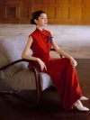 Modern Dark Red Chinese Slim Fit Qipao Dress, woman in sleeveless qipao vest and maxi skirt set sitting on vintage armchair, modern qipao dresses with purple floral accent, elegant silhouette