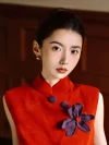 Close-up of Modern Dark Red Qipao Chinese Dress, mandarin collar with purple flower and button details, texture of elegant modern qipao dresses fabric, traditional chinese design elements