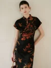 Model leaning against a soft beige wall, wearing a modern high end lightweight short sleeve cheongsam dress. The black mulberry silk qipao features a rich nature inspired print, perfect for elegant everyday wear.