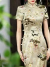 Close-up of a premium mulberry silk printed midi qipao, highlighting the traditional frog buttons, intricate floral print, and tailored upper-body silhouette.