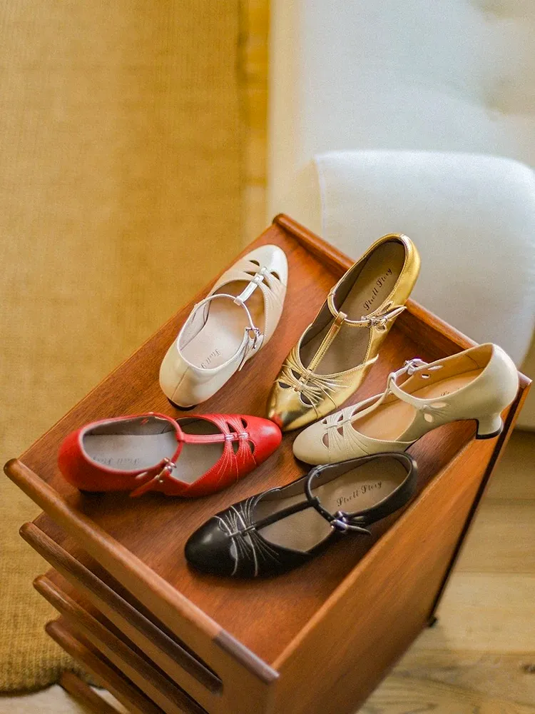 Multi color collection of vintage genuine leather T strap high heel qipao sandals, featuring red cream gold black and beige options, displayed on a warm wooden table, catering to various retro and cheongsam styling needs