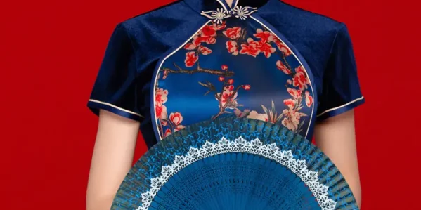 Close-up of navy velvet floral mandarin collar cheongsam blouse, elegant chinese qipao style top with a folding fan on classic red background