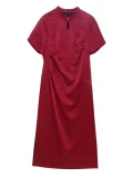 Full view of a plus size red satin qipao dress on a white background, showcasing the complete silhouette, keyhole neckline, subtle jacquard pattern and elegant details of this classic chinese red qipao.