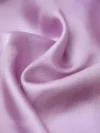 Close-up texture shot of premium lavender mulberry silk fabric used for women's modern cheongsam shirts, showcasing the soft, lustrous finish and smooth drape of this high-quality qipao top material.