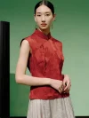 Model wearing a women's red chinese slim fit jacquard cheongsam top, a red modern mandarin collar cheongsam top, posing in a studio with a soft green background.