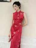 Side view close-up of women's red Chinese cheongsam dress, sleeveless modern wedding qipao with teardrop mandarin collar, delicate golden butterfly embroidery, and smooth satin fabric