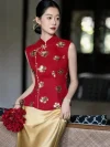 Red and Gold 2 Piece Qipao - Elegant Chinese wedding qipao with gold sequin flower embroidery on red mandarin collar top, paired with golden satin skirt, bride holding red flower bouquet in moody indoor setting