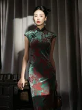 Full-body view of a model wearing the women's vintage red and green floral pattern midi cheongsam, a classic traditional chinese qipao dress. The flowing velvet drape, detailed prints, and elegant silhouette of this timeless cheongsam are showcased in soft studio lighting, blending traditional charm with modern styling.