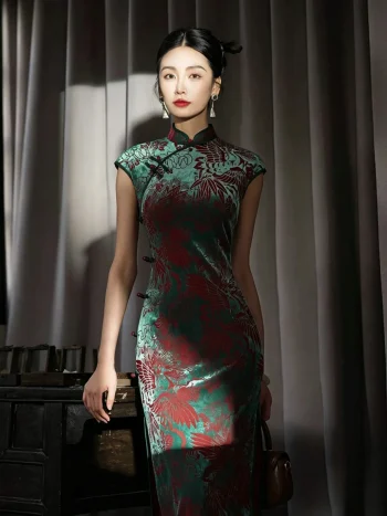 Full-body view of a model wearing the women's vintage red and green floral pattern midi cheongsam, a classic traditional chinese qipao dress. The flowing velvet drape, detailed prints, and elegant silhouette of this timeless cheongsam are showcased in soft studio lighting, blending traditional charm with modern styling.