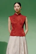 Full front view of a model wearing a red modern mandarin collar cheongsam top, a women's red chinese slim fit jacquard cheongsam top, showcasing the elegant tailored silhouette.