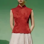 Full front view of a model wearing a red modern mandarin collar cheongsam top, a women's red chinese slim fit jacquard cheongsam top, showcasing the elegant tailored silhouette.