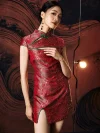 Close-up shot of model in a red modern short qipao dress, focusing on the chest cutout with green trim, intricate wave brocade pattern, and the dress’s tailored fit on smooth satin fabric.