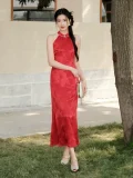 Full-body view of women's red mulberry silk halter neck midi qipao dress, a modern wedding cheongsam with slim fit silhouette, side slit, and delicate floral jacquard on premium mulberry silk fabric