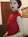 Women's Red Qipao Dress - Close-up of bride in modified chinese qipao dress with red floral hair accessories, sleeveless mandarin collar design for modern women's qipao dress