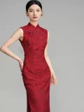 Full front view of woman in deep red floral qipao dress, form-fitting sleeveless chinese cheongsam with high side slit and mandarin collar, vintage elegant style for special occasions.