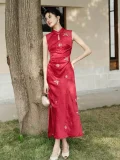 Outdoor full-body shot of women's red sleeveless modern wedding cheongsam dress, a Chinese qipao featuring teardrop mandarin collar, golden butterfly & floral embroidery, and slim fit silhouette for summer bridal occasions