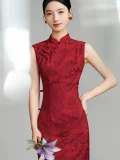 Bust shot of woman in red floral jacquard vintage qipao, sleeveless chinese cheongsam dress with mandarin collar, holding a lily flower against a soft neutral studio background.
