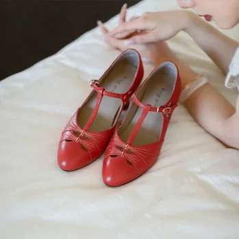 Womens vintage high heel qipao sandals in vibrant red, crafted from premium genuine leather with classic T strap and cutout details, displayed on soft white bedding under natural light, ideal for retro cheongsam styling