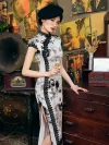 Model holding a glass, wearing 1920s Shanghai-style Chinese silk cheongsam with ink-wash floral and bamboo print, black lace side trim, against vintage movie poster background.