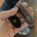 Vintage rose-shaped buckle detail on 1920s replica cheongsam leather shoes, decorative fastener for classic qipao shoes