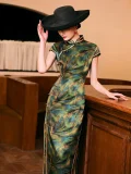 Side view of a woman in a shanghai style retro qipao dress, mulberry silk cheongsam with high slit and traditional frog buttons, leaning against a bar counter in a vintage setting with a black hat.