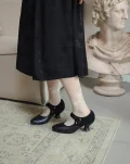 Side view of black 1920s replica cheongsam leather shoes styled with floral lace socks and vintage cheongsam, elegant cheongsam shoes