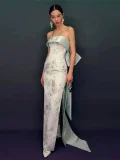 Side view of form-fitting qipao prom dress, showing the elegant mermaid silhouette, large back bow detail and high side slit for modern prom style.