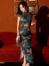 Close-up shot of model in a vintage floral pattern silk qipao dress, showing the vibrant print, smooth silk texture, and high slit detail with a crystal clutch in a warm-toned studio.