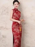 Smiling model wearing the women's chinese red floral pattern cheongsam, a red cheongsam dress with classic mandarin collar and vibrant red floral print. This sleeveless cheongsam dress exudes warm festive charm, ideal for bridal photoshoots, tea ceremonies, and special occasions.
