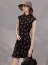 Close-up side view of a woman in a black rose print sleeveless short qipao dress, wearing a sun hat and holding a handbag, showcasing the dress's elegant lines.