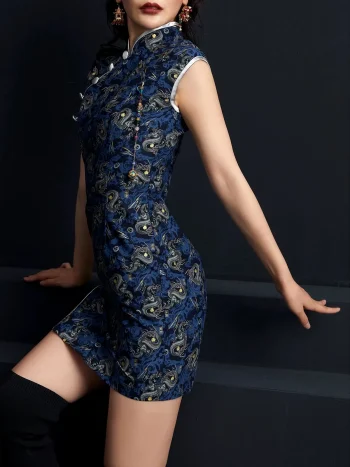 Three-quarter side view of a woman in a dark blue peacock print short cheongsam dress, showcasing the high side slit, sleek silhouette, and detailed peacock pattern of this modern short cheongsam.