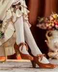 1920s replica genuine leather ribbon mary jane qipao shoes in rich brown, shown on feet with vintage dress and knit socks, highlighting the charming ribbon bow and comfortable heel design for period-style looks