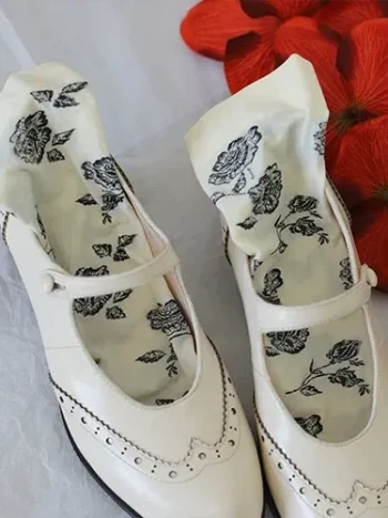 Vintage floral print white socks styled with white leather Mary Jane qipao shoes, featuring delicate rose patterns for elegant traditional and retro outfits