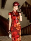 Model wearing a high-end mulberry silk cheongsam dress with red and yellow floral print, standing on a vintage wooden staircase. The traditional frog buttons and tailored silhouette highlight the elegant charm of the yellow-accented red cheongsam.