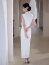 Back view of a woman in a white lace cheongsam dress walking in a light-colored arched corridor, showcasing the dress's back zipper, sleeveless design, and delicate lace hem details.