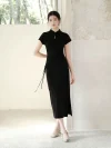 Full side view of a woman wearing a black slim fit qipao dress. This women qipao features adjustable side drawstrings for a custom fit, a high side slit, and a timeless minimalist aesthetic.