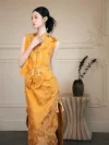 Close-up of Modern Yellow Cheongsam - Chinese cheongsam dress with pearl tassel frog buttons and floral jacquard fabric, elegant qipao details for weddings and formal events