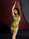 Upper body close-up of the women's modernized lemon yellow short qipao dress, focusing on the grey floral jacquard pattern, halter neck with keyhole cutout, and the dress's sleek silhouette; elegant yellow qipao dress detail
