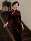 Beautiful chinese model in fitted Velvet Long Sleeve Burgundy Cheongsam with fine silver butterfly fasteners, one hand leaning on dark wood stair handrail near traditional chinese antique wooden furniture, high-end soft Cheongsam Velvet long sleeve formal wear