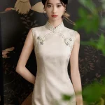 Stunning front view of a refined sleeveless white qipao dress with traditional knot buttons and mandarin collar.